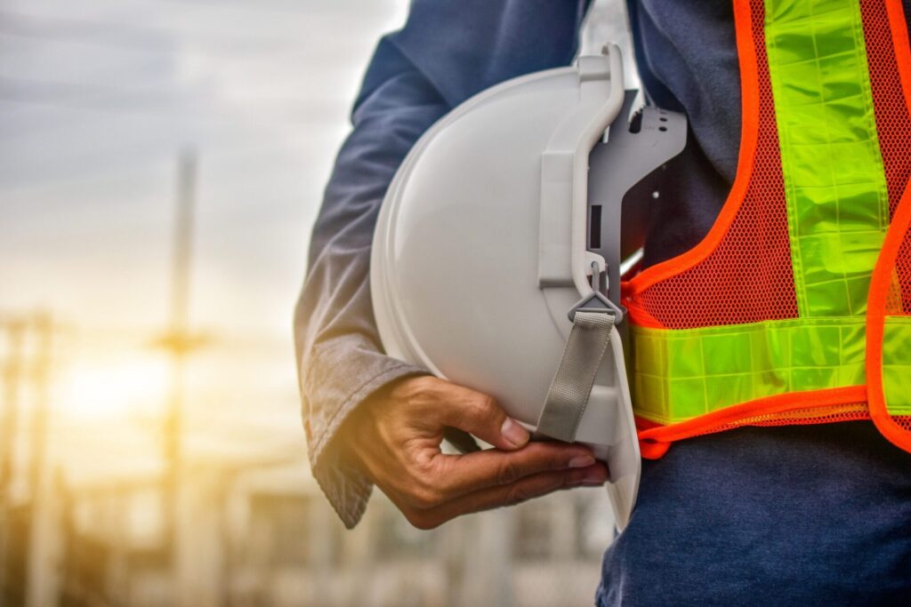 man in reflective vest with a hard hat